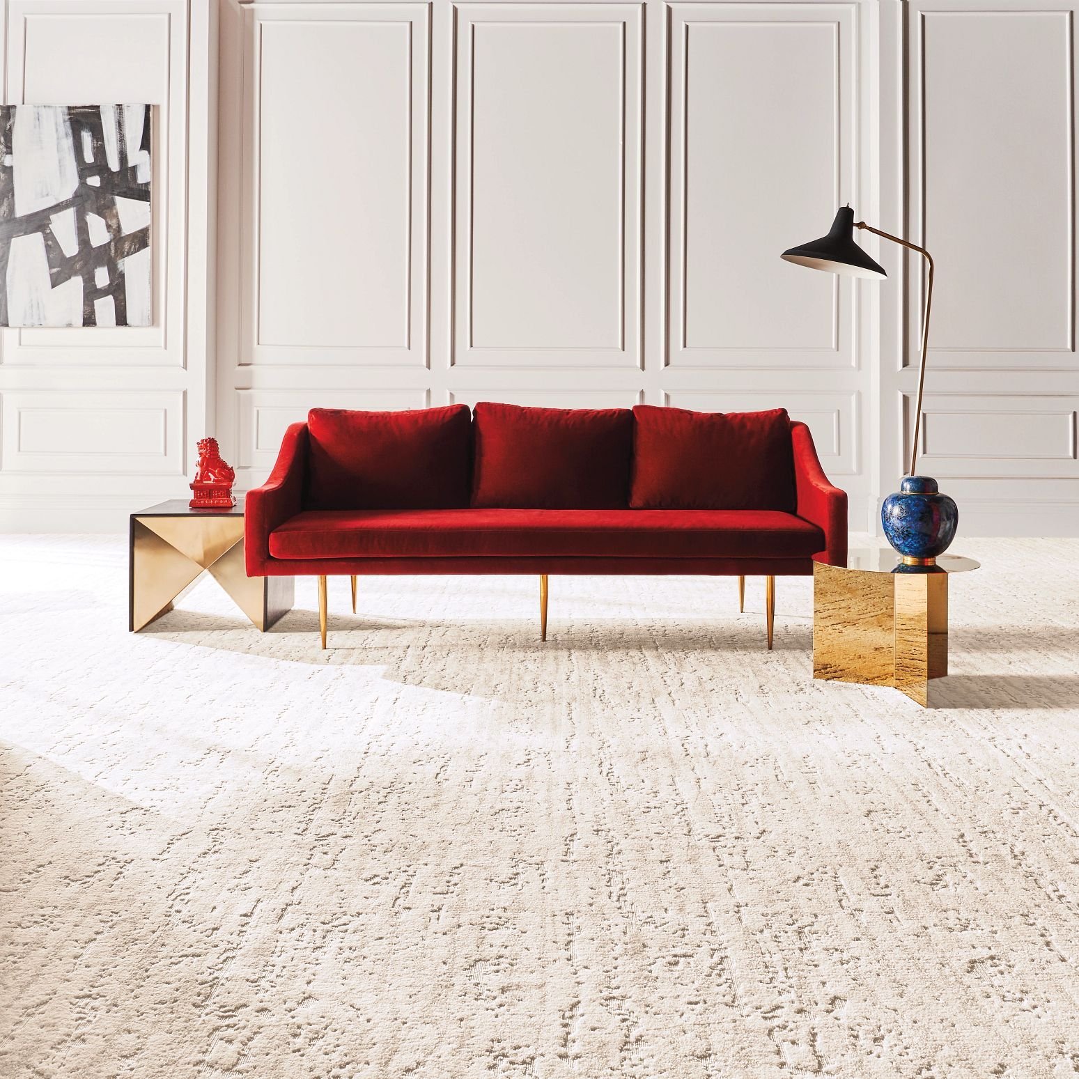 Bright living room with a red velvet couch and beige textured carpet from Floor Fashions of Virginia in the Charlottesville, VA area